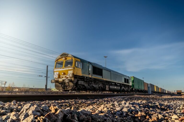 Freight train moving along railway tracks.