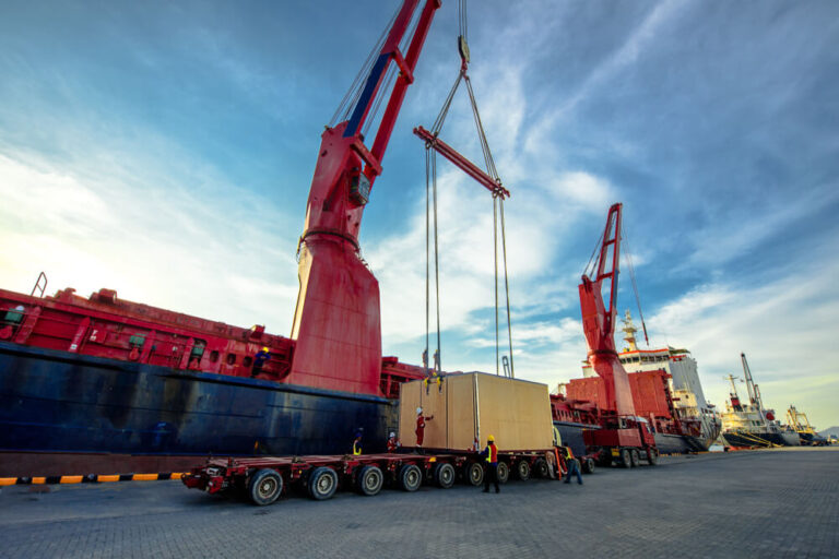 Gantry crane in maritime industry, crane is lifting cargo onto a ship